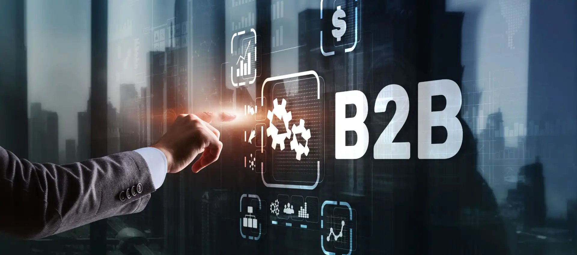 Foto da mão de um profissional interagindo com uma tela digital que exibe elementos relacionados a negociação entre empresas, representando a elaboração de uma estratégia de marketing B2B.